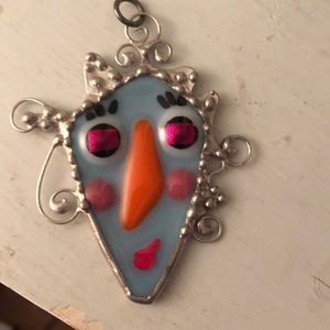 Handmade silver and stained glass pendant.